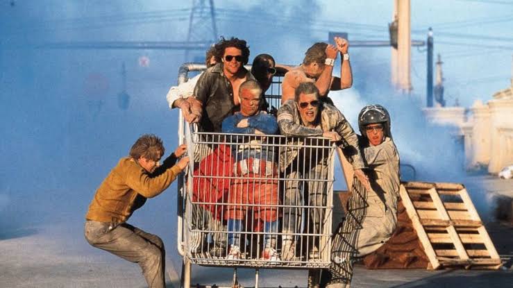 The Jackass crew ride their gigantic shopping cart.