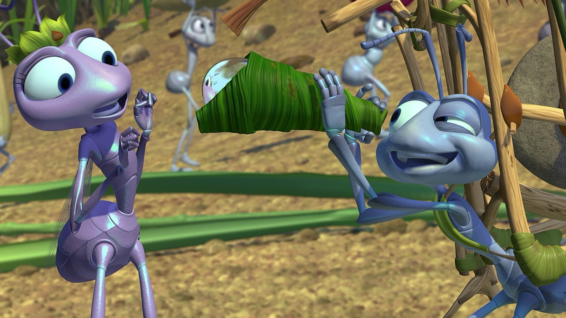 Flik the ant looks at Princess Atta through a telescope he's fashioned from a leaf and a drop of water.